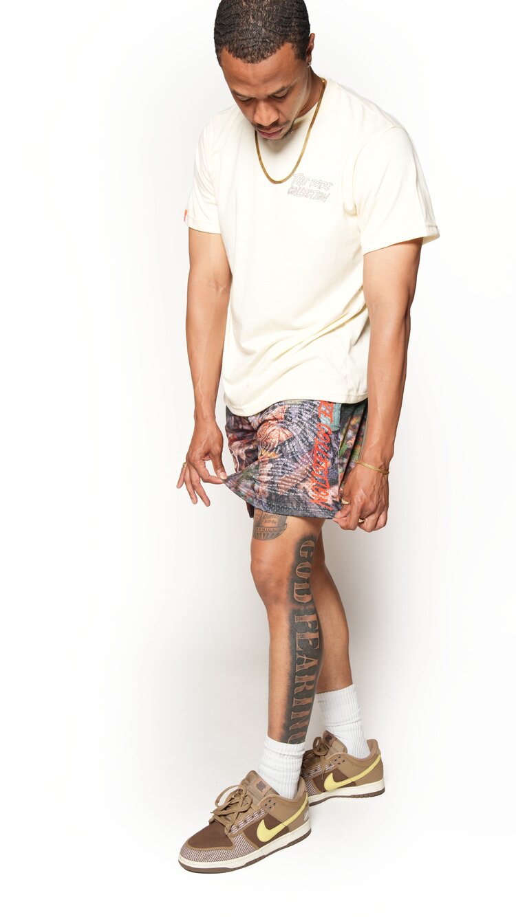 real tree camp print, DNA Fingerprint shorts, side view, black male model