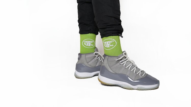 Neon green, Trc Riches are rewards earned socks, side view, cool grey jordans