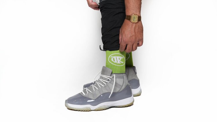 Neon green, Trc Riches are rewards earned socks, side view, cool grey jordans